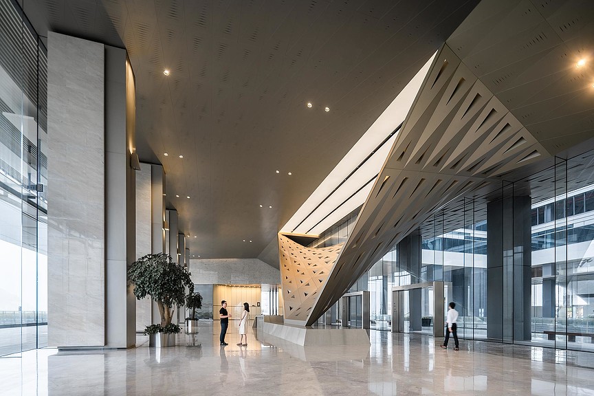 A group of people walking inside a building.